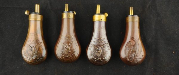 079-0321-0992, Lot of collectible pistol flasks. Fine to excellent overall. BUY NOW