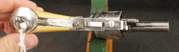 079-0625-9308, Continental .32 CF, folding trigger factory engraved revolver. BLOWOUT - Image 2