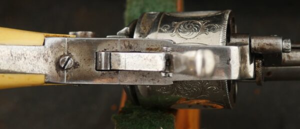 079-0625-9308, Continental .32 CF, folding trigger factory engraved revolver. BLOWOUT - Image 9