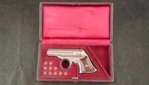 GR-0925-6648, Wonderful Remington Elliot 5 shot pepperbox in .22 RF with exceptional dealer deluxe engraving and silver finish. BUY NOW