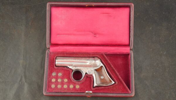 GR-0925-6648, Wonderful Remington Elliot 5 shot pepperbox in .22 RF with exceptional dealer deluxe engraving and silver finish. BUY NOW